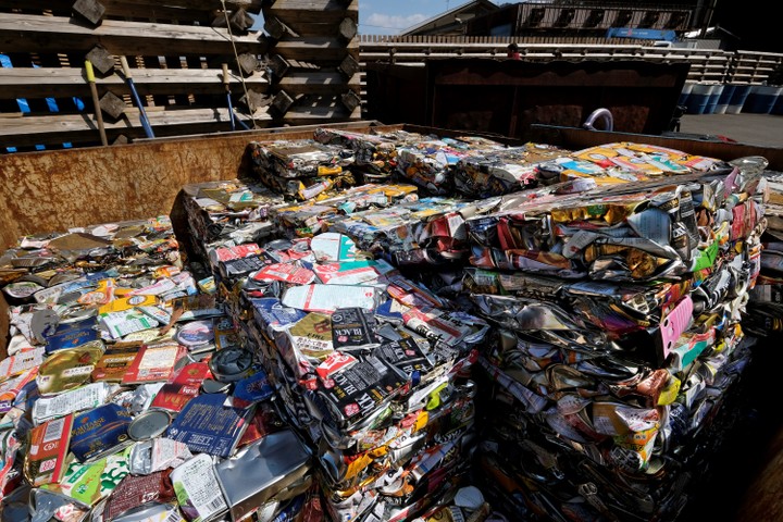 This picture taken on March 14, 2019 shows stacks of compacted aluminium cans at a waste centre in the town of Kamikatsu, Tokushima prefecture.