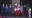 Leaders of the three nations pose for an official photo as their wives stand to the side in Mexico City.