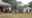 A still image taken from a video shot on December 9, 2017 shows Cameroonian refugees standing outside a center in Agbokim Waterfalls village, which borders on Cameroon, Nigeria.