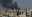Black smoke rises from Raqqa city, northeast Syria, Thursday, July 27, 2017. 