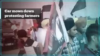 Indian minister's car ploughs into protesting farmers