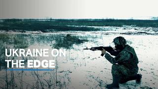 Ukraine on edge as Russian troops converge on border