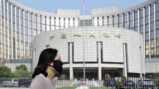 China slashes benchmark rates, hikes stimulus to prop up economy