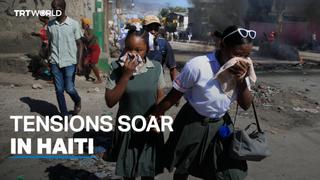 Police block roads and force their way into main airport in Haiti