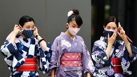 Japan proposes extending Covid curbs as infections surge – latest updates