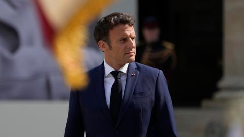 Tomatoes hurled at France's Macron on first post-election trip