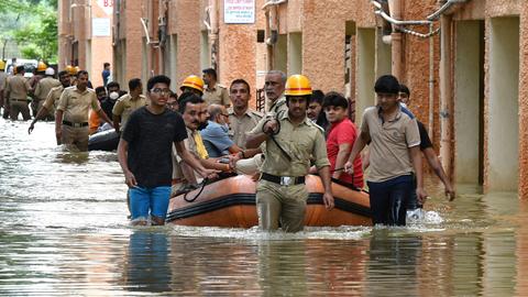 Mass displacements as rain-triggered floods hit India’s northeast