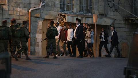 Dozens of Palestinians injured as Israeli settles storm West Bank shrine