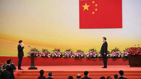 China's Xi swears in new Hong Kong chief on its handover anniversary