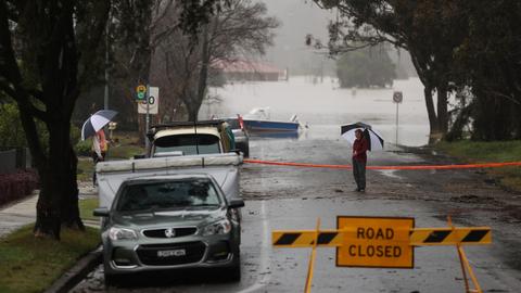 Australians in Sydney assess damage as weather eases