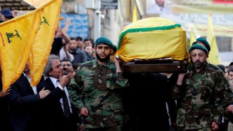 Hezbollah blames opposition shelling for commander's death