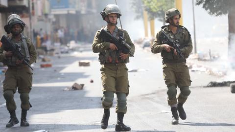 Israeli forces kill Palestinian youth, wound dozens in occupied West Bank