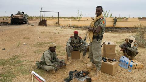 Armed men kill several civilians in raid on Mali camp
