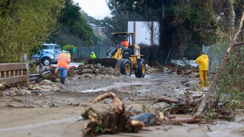 Landslides, sinkholes, floodwaters plague California as more storms loom