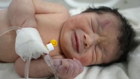 Syria rescuers cut umbilical cord before pulling newborn alive from rubble
