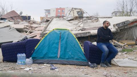 Man’s heartbreaking quest to catch last glimpse of his kin lost in rubble