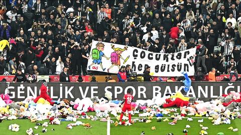 Football fans shower field with toys for children in quake-hit Türkiye