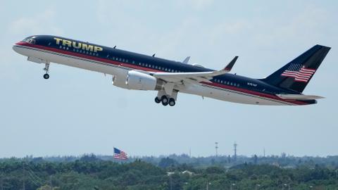 Trump flies to New York to surrender after indictment