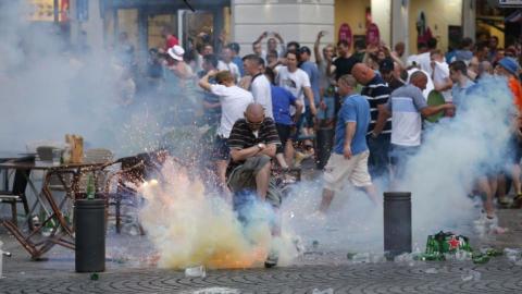 French police clash with British and Russian football fans