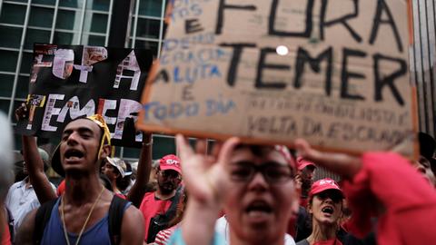 Protesters rally in Brazil as lawmakers reject graft charges against Temer