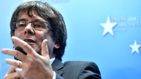 Axed Catalan leader accepts 'challenge' of snap election
