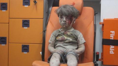 Photo of dazed child survivor in Aleppo sums up Syria horror