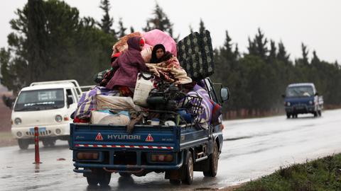 Syrian regime forces press Idlib offensive as people flee homes