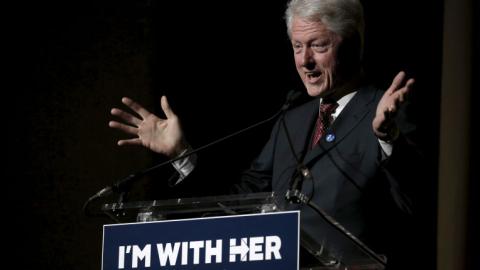 Bill Clinton confronts protesters angry at his crime reforms