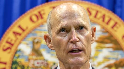 Florida governor signs gun restrictions 3 weeks after attack