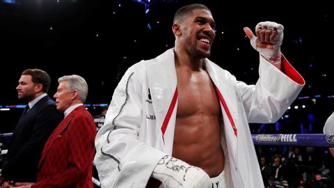 Joshua goes the distance before beating Parker in world heavyweight clash