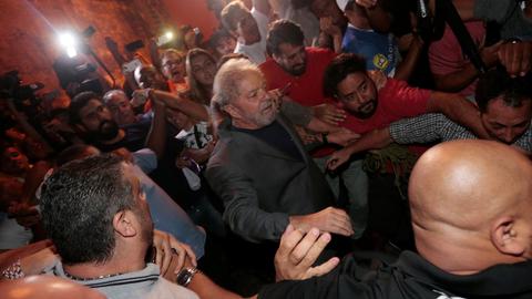 Brazil's Lula turns himself in to police, ending stand-off