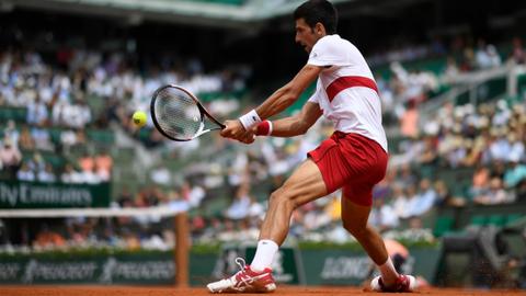 Wawrinka crashes, Djokovic through as rains halts Nadal and Sharapova