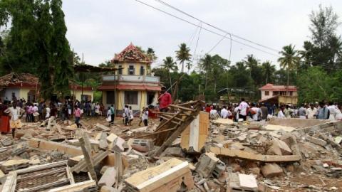 Indian police detain five after temple fire kills 110