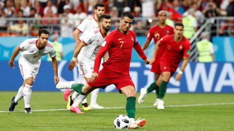 Spain, Portugal reach World Cup knockout round