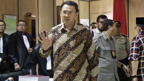 Jakarta governor denies blasphemy charge as his trial begins