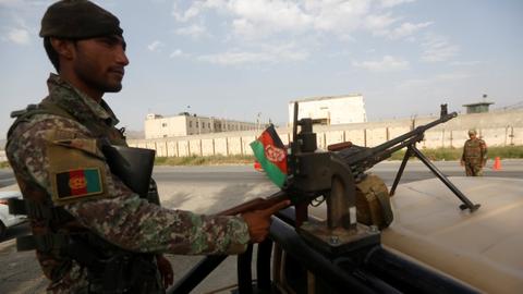 Afghan forces clash with Taliban to retain control over military base
