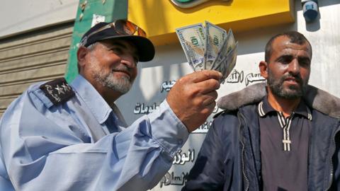 Qatar pays Gaza salaries in effort to ease tensions