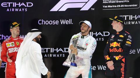 Hamilton wins crash-hit Abu Dhabi GP