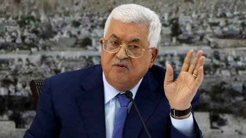 Why does Abbas want to dissolve Palestinian parliament?