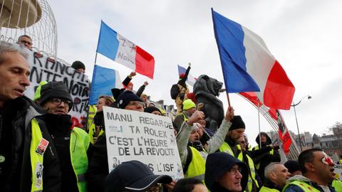 French 'yellow vests' march through Paris against police violence