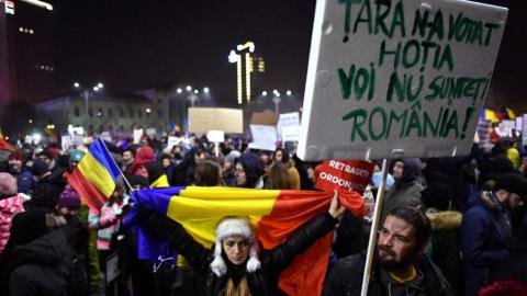 Romania's justice minister quits as protests continue over graft law