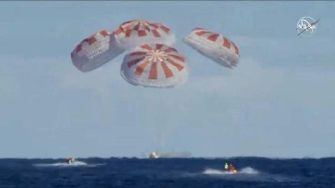 SpaceX crew capsule ends test flight with ocean splashdown