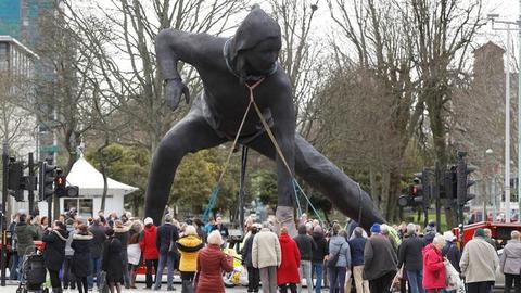 Britain's biggest bronze statue crosses land and sea to reach new home