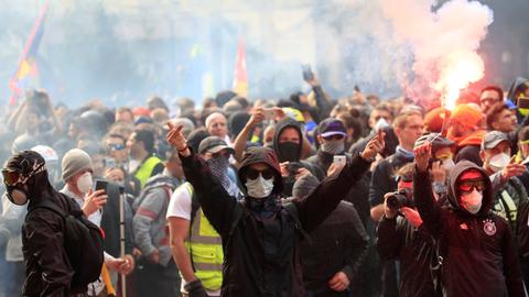Riot police, masked protesters clash at Paris May Day rally