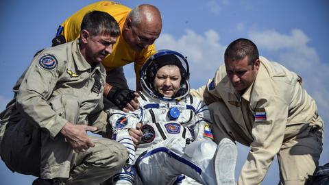 Russian, North American astronauts return to earth