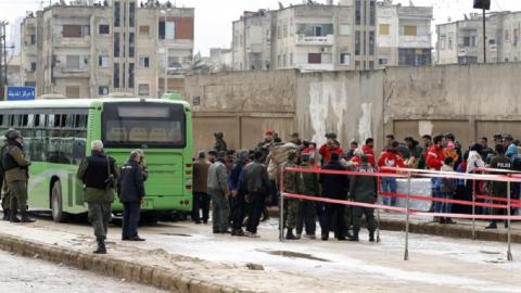 Syrian rebels, civilians leave Homs after deal with regime