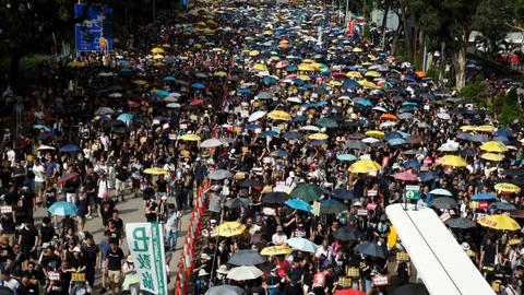 Hong Kong protesters egg China office at end of massive rally