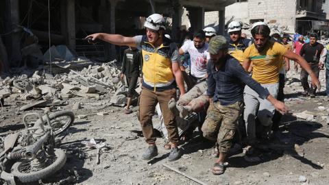 Air strikes kill at least 19 people in Syria's Idlib province, rescuers say