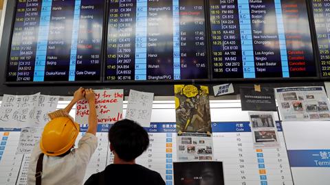 Hong Kong's airport reopens, more than 200 flights cancelled