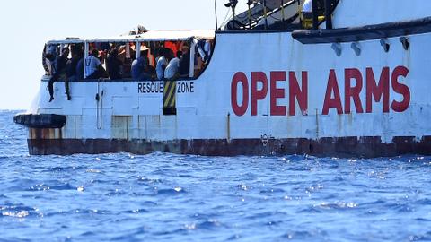 Charity ship says migrants' safety at risk, Italy to allow minors off